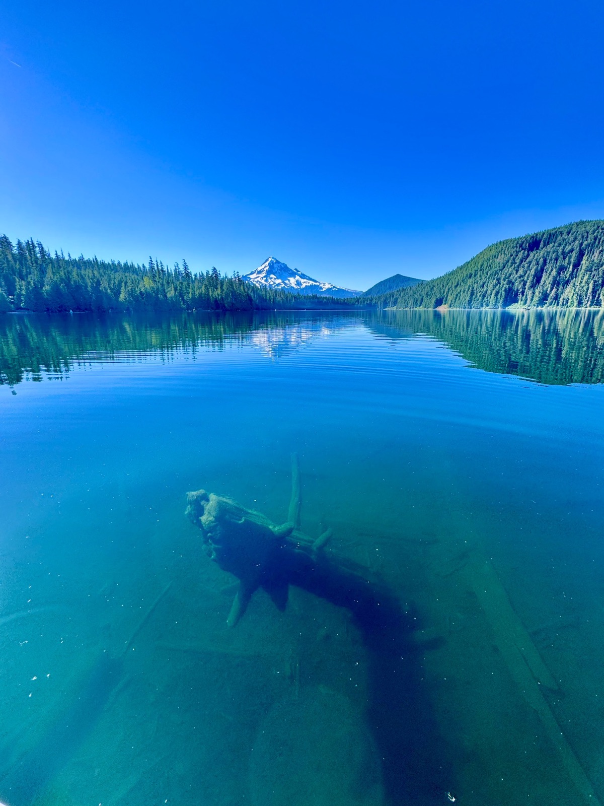 Mountain reflected in a clear blue lake